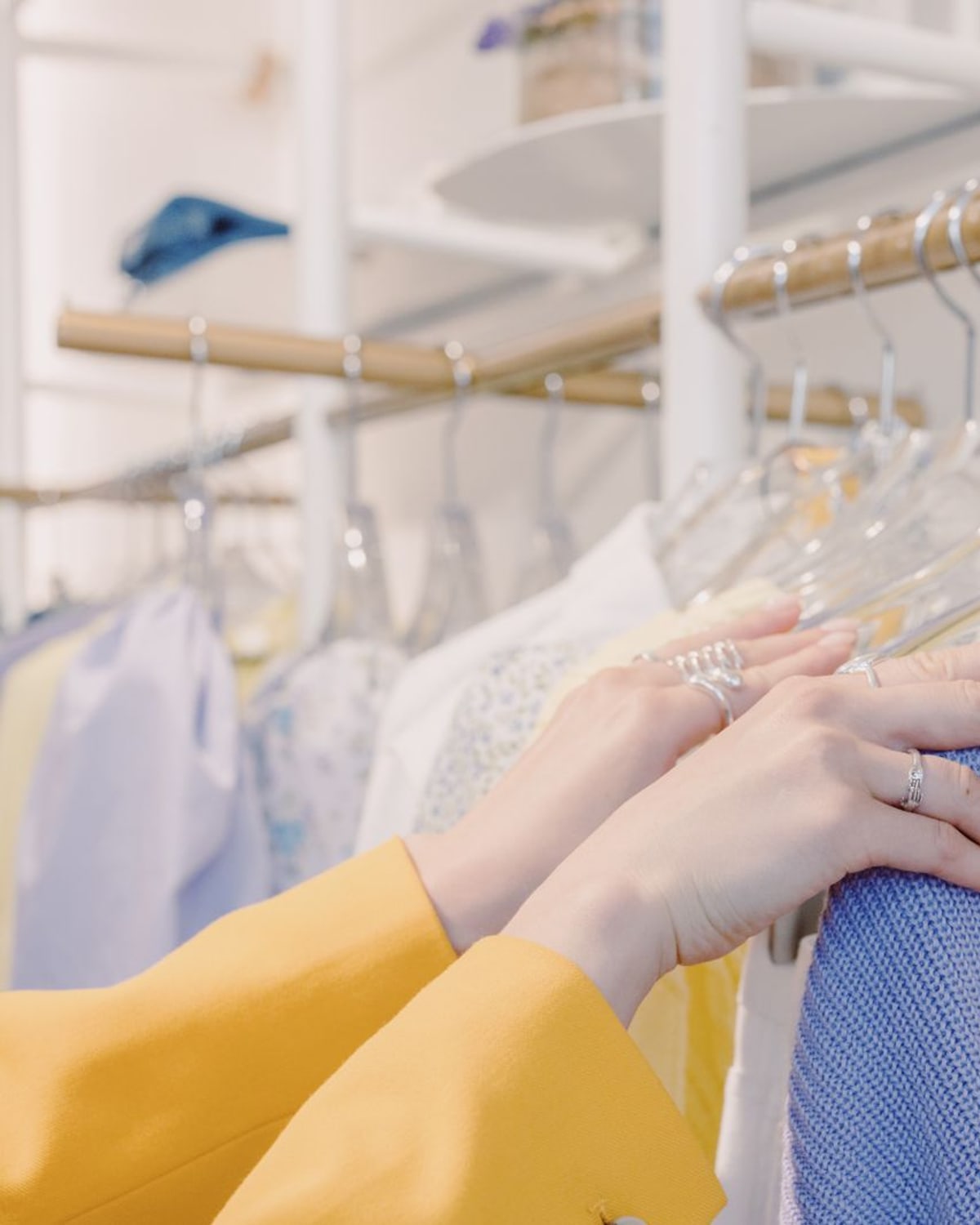 Curated clothing pieces arranged for a capsule wardrobe