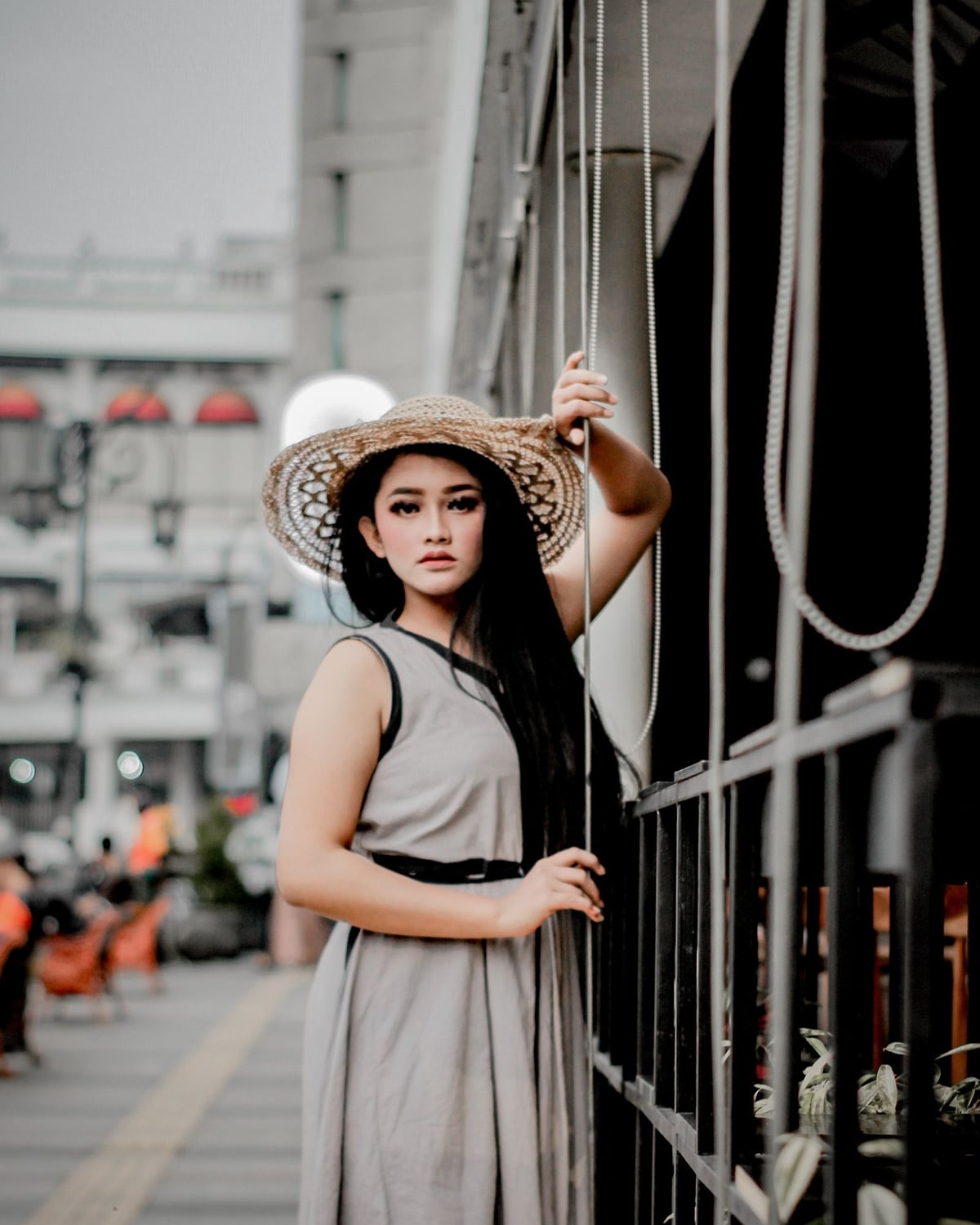 Full-length portrait of a woman wearing a long dress